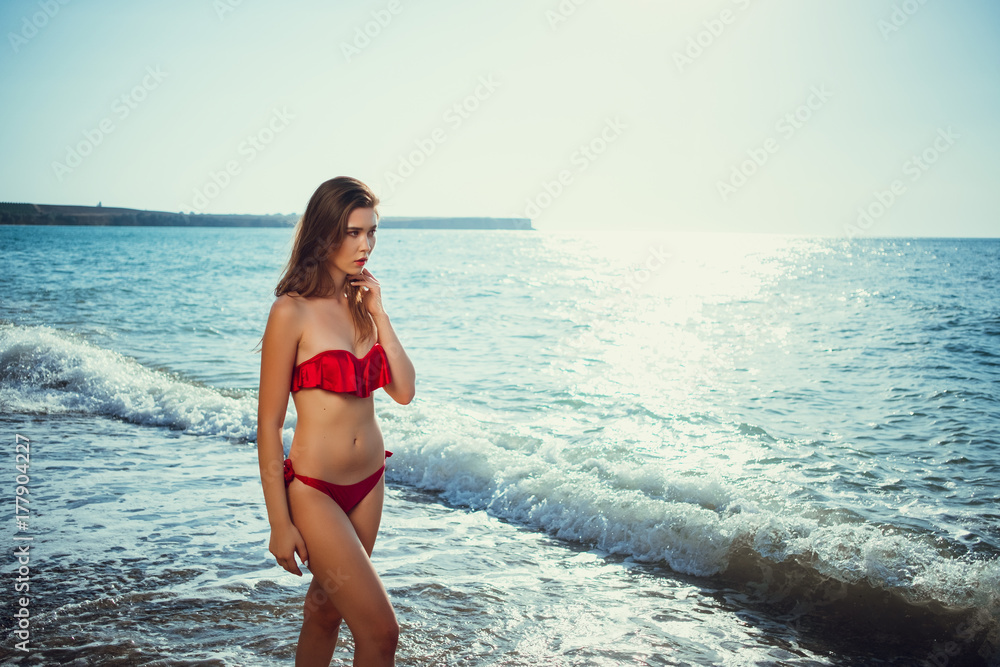 Summer beach vacation holidays woman happy joyful and laughing. Summer travel getaway concept with multiracial Asian Chinese / Caucasian woman in bikini in the sun Summer beach vacation holidays woman happy joyful and laughing. Summer travel getaway concept with multiracial Asian Chinese / Caucasian woman in bikini in the sun