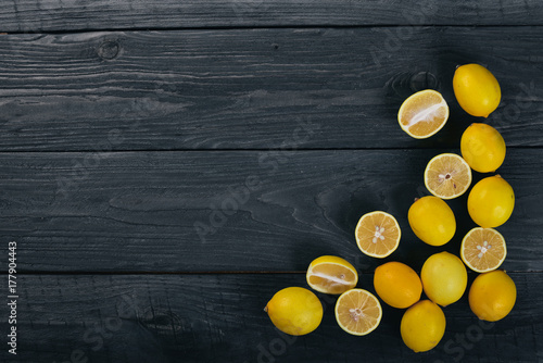 Fresh lemons. On a wooden background. Top view. Free space for your text.