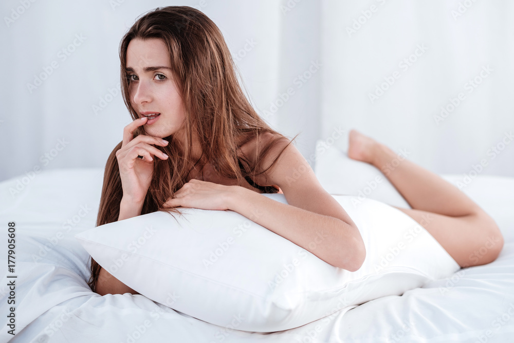 Young Woman wearing bikini enjoying her summer holidays, relaxing on the beach bed