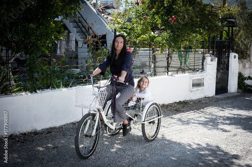 Fototapeta Naklejka Na Ścianę i Meble -  mother and daughter riding bike