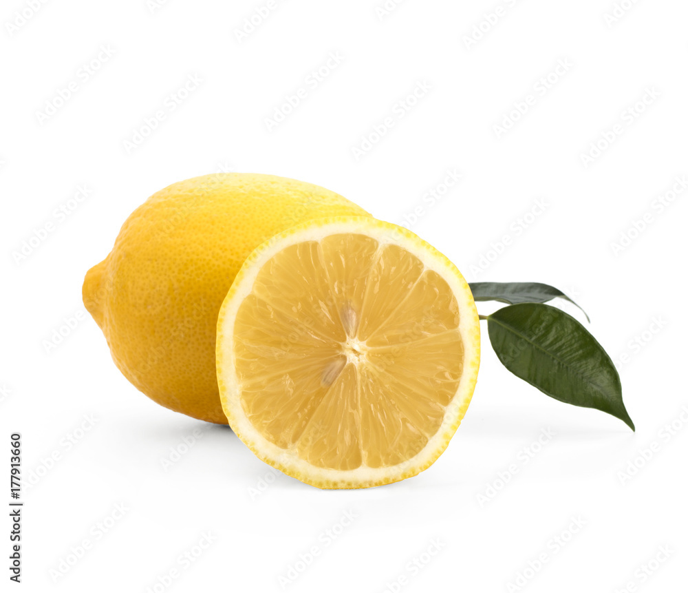Lemon with green leaves on a white background