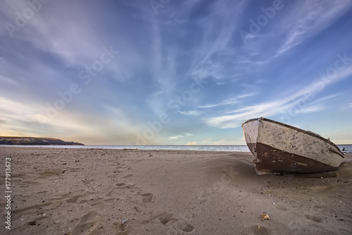 lonely old boat on the beach