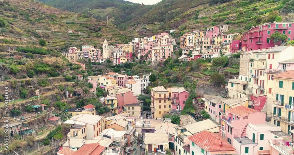 Amazing aerial view of Manarola village on cliff rocks and turquoise sea.Stunning view of beautiful and cozy town in Cinque Terre Reserve,Liguria,Italy,Europe.Travel destination, adventure concept. Amazing aerial view of Manarola village on cliff rocks and turquoise sea.Stunning view of beautiful and cozy town in Cinque Terre Reserve,Liguria,Italy,Europe.Travel destination, adventure concept.