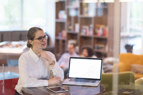 businesswoman using a laptop in startup office