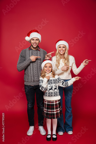 Full length portrait of a cheerful young family