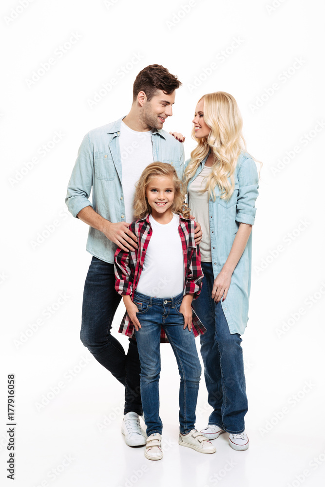 Full length portrait of a young beautiful family standing together Full length portrait of a young beautiful family standing together