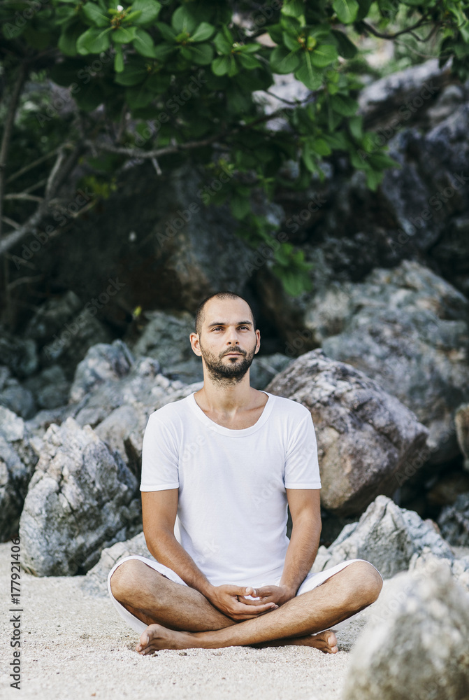 Caucasian Man Meditating Outdoors Caucasian Man Meditating Outdoors