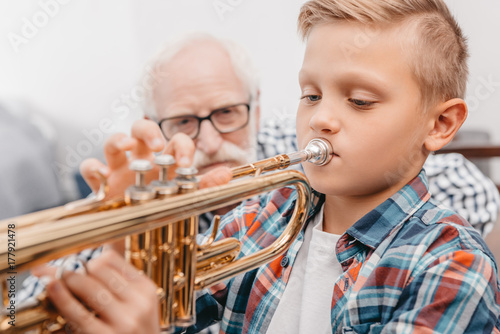 boy practicing trumpet