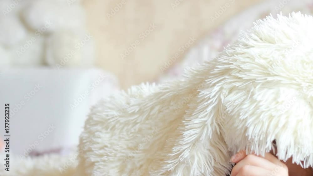 Mom and daughter lies in bed under the blanket and embrace and kiss. Mother and child play, hug and kiss. The concept motherhood Mom and daughter lies in bed under the blanket and embrace and kiss. Mother and child play, hug and kiss. The concept motherhood