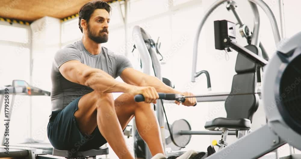 Young handsome man doing exercises in gym Young handsome man doing exercises in gym
