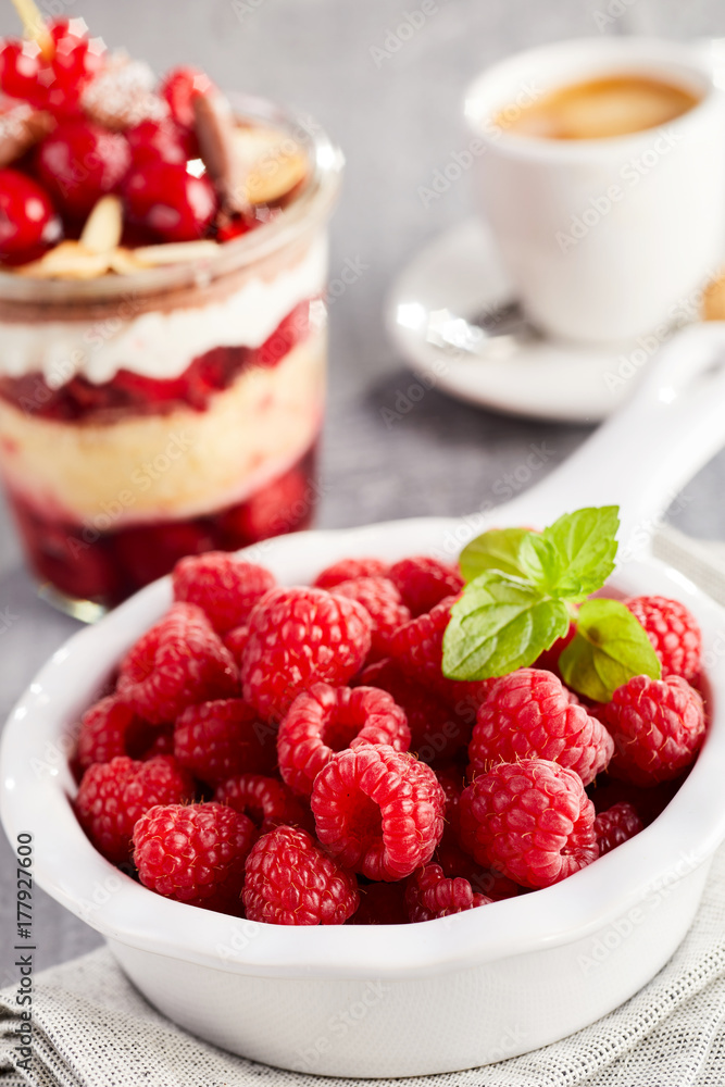 Bowl of fresh raspberries on table Bowl of fresh raspberries on table