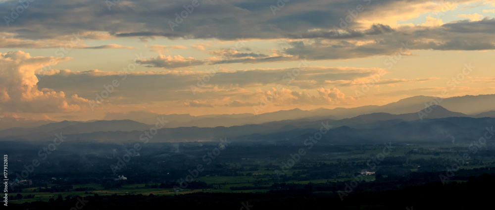 countryside field with twilight sky and clouds at morning before sunrise.