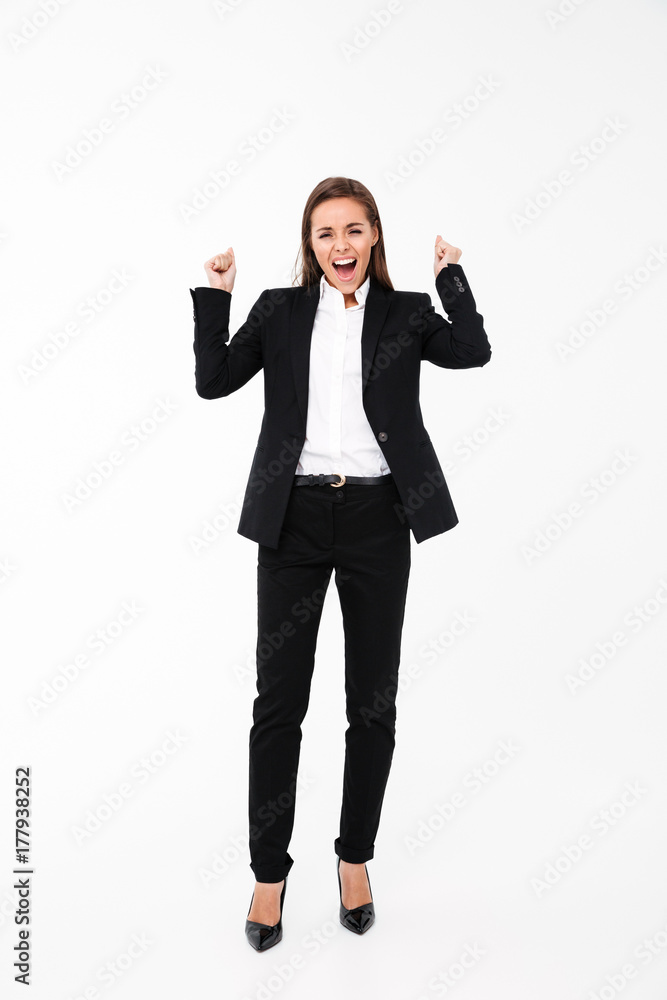 Screaming businesswoman make winner gesture Screaming businesswoman make winner gesture