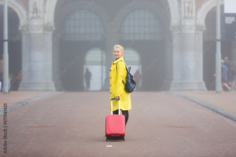 Traveler in misty Amsterdam Traveler in misty Amsterdam