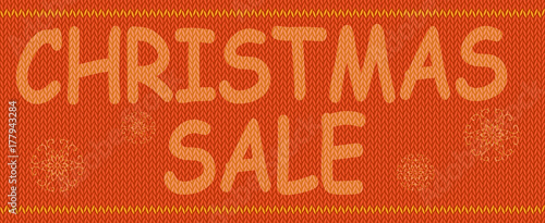 Christmas advertising text on background of knitted texture. 