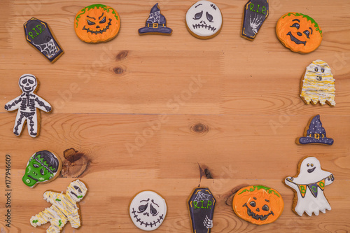 Cookies of different kinds for Halloween on a wooden table. Preparing for Halloween. photo