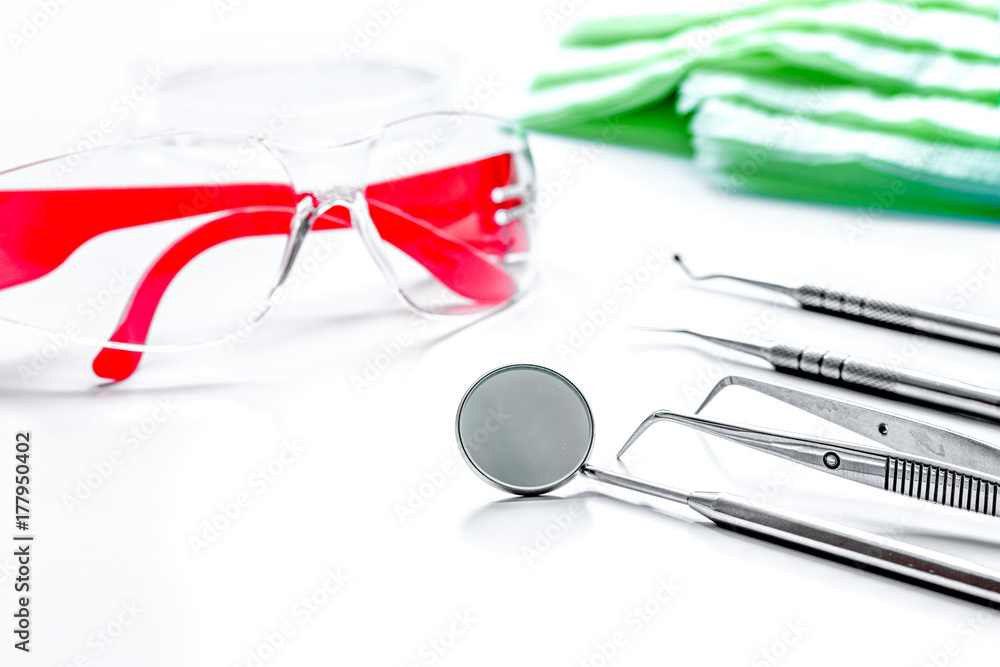 dentists tools in cabinet on white desktop dentists tools in cabinet on white desktop