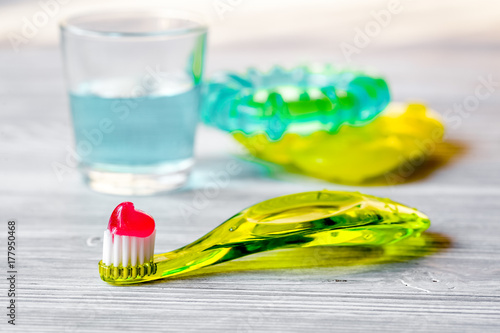 children s toothbrush oral care on wooden background