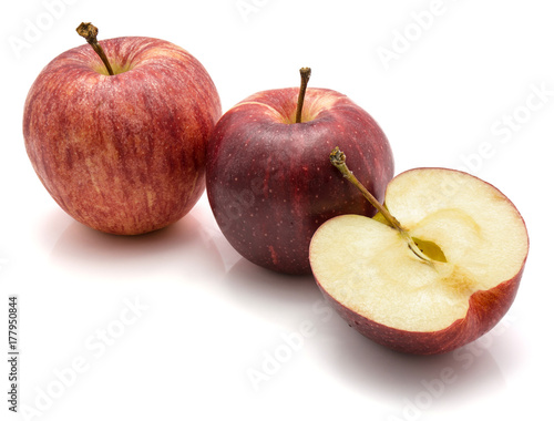 Gala apples, two whole and one half, isolated on white background