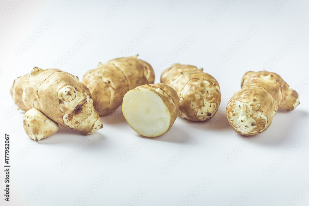 Jerusalem artichoke on a white background. Jerusalem artichoke on a white background.