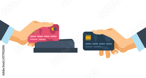 Hands holding credit plastic cards, used in payment device terminal.