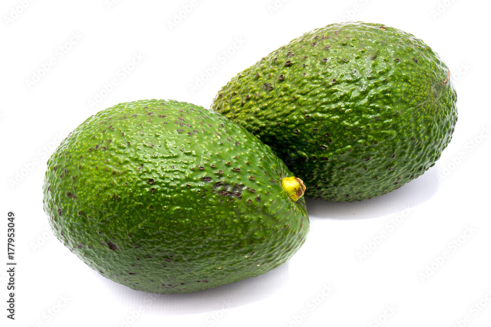Two whole avocado (Persea americana, alligator pear) isolated on white background Two whole avocado (Persea americana, alligator pear) isolated on white background