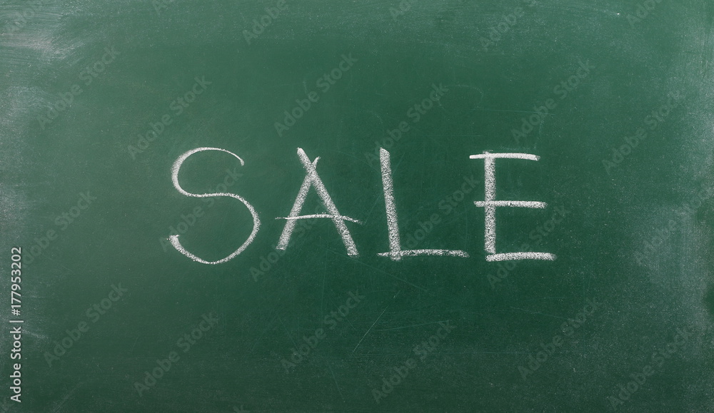 Sale word drawn on chalkboard, blackboard texture Sale word drawn on chalkboard, blackboard texture