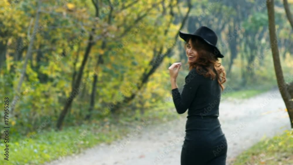 Fashion woman walking in autumn park Fashion woman walking in autumn park