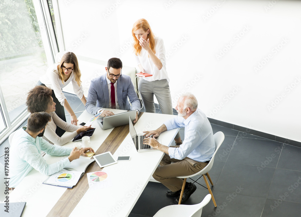 Joyful multiracial business team at work in modern office Joyful multiracial business team at work in modern office
