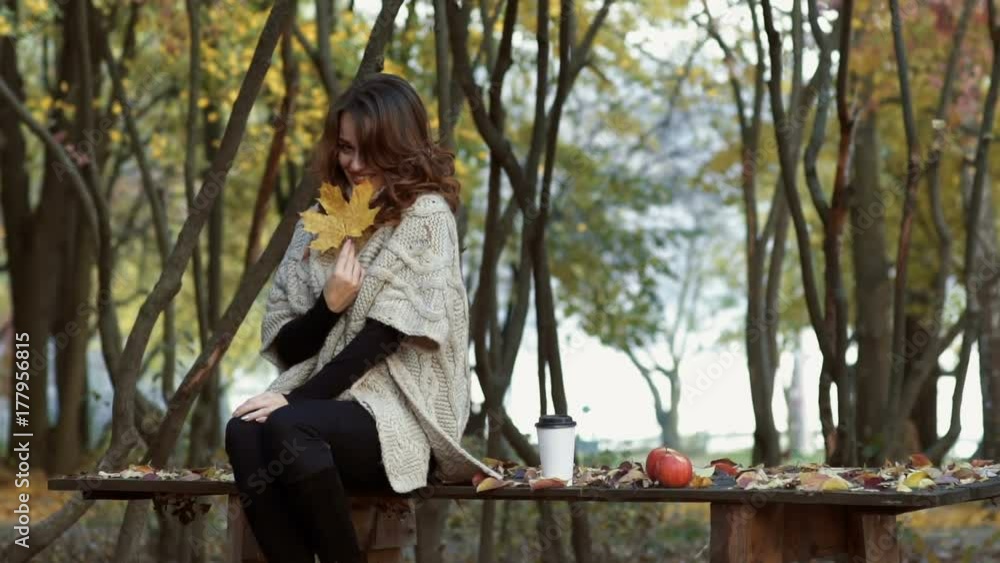 Elegant woman walking in a park Elegant woman walking in a park