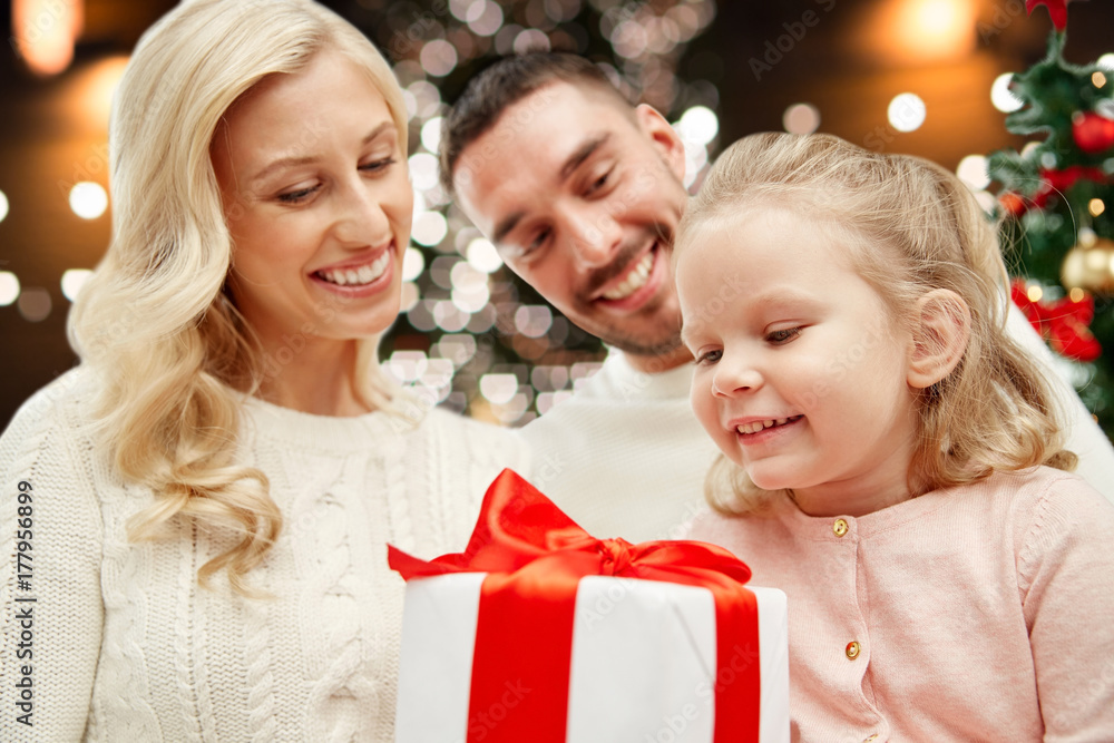 happy family at home with christmas gift box happy family at home with christmas gift box
