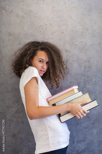 Curly hair teen girl with g...
