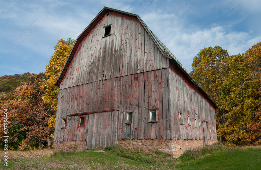 Rustic Barn in Autumn: Trees in fall colors surround a weathered barn in southern Wisconsin. Rustic Barn in Autumn: Trees in fall colors surround a weathered barn in southern Wisconsin.