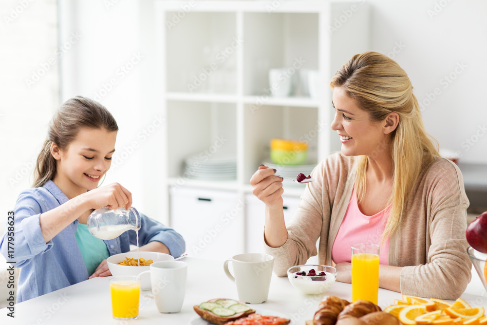happy family having breakfast at home kitchen happy family having breakfast at home kitchen