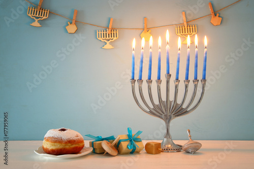 image of jewish holiday Hanukkah background with traditional spinnig top, menorah (traditional candelabra)