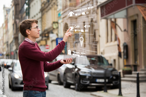 Augmented reality in marketing. Man with phone. Navigation on the projection of the display © scharfsinn86