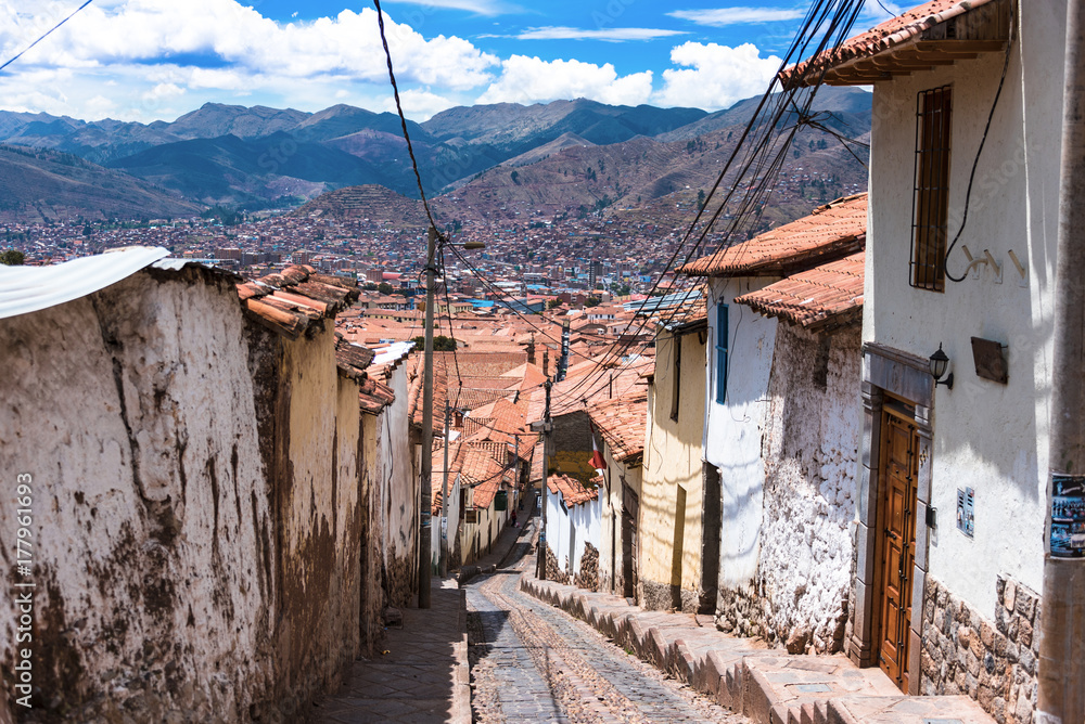 Street with steps overlooking Cusco rooftops.
