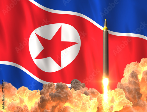 Rocket Launch On The Background Of North Korean Flag photo