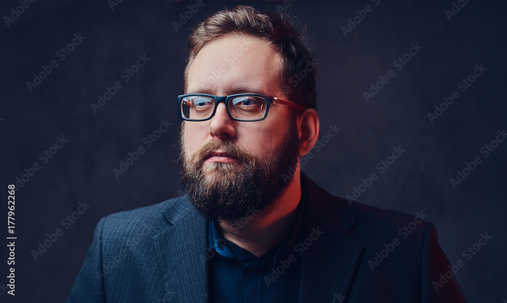 Fototapeta premium Serious plump male in eyeglasses over grey background.