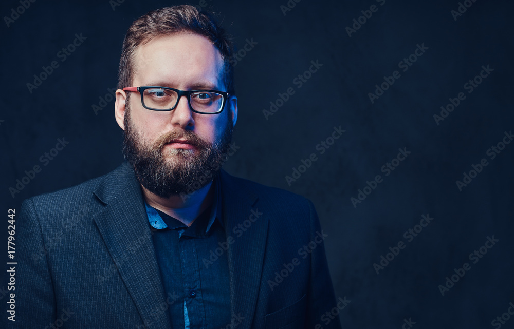 Serious plump male in eyeglasses over grey background. Serious plump male in eyeglasses over grey background.