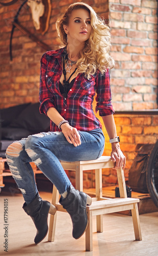 Portrait of blonde female dressed in a jeans and fleece shirt.