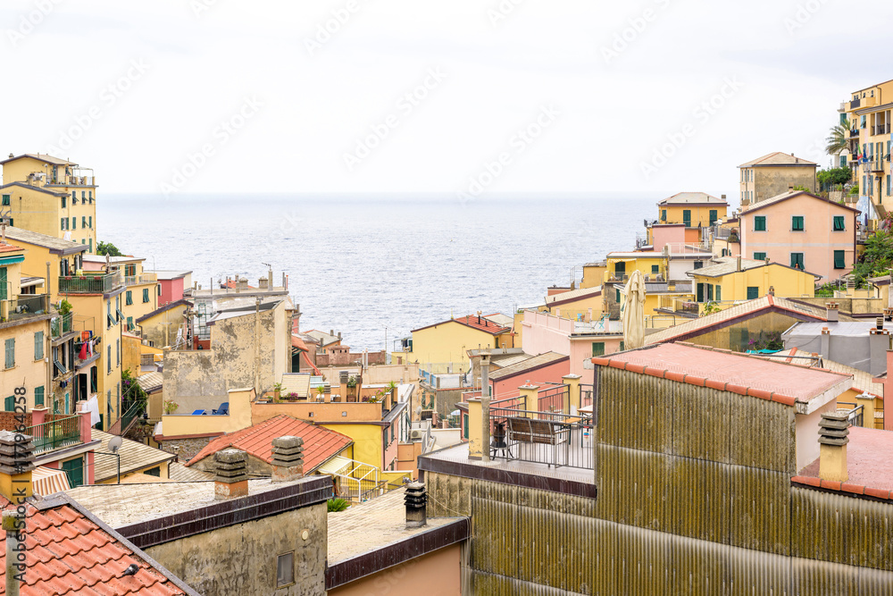 View to city buildings and sea in Vernazza, Cinque Terre, Italy