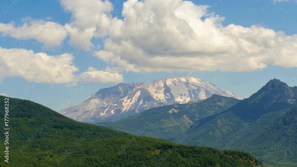 Ultra high definition 4k time lapse video of moving white clouds and blue sky with moving sun shadow over Mount St. Helens closeup 3840x2160 Ultra high definition 4k time lapse video of moving white clouds and blue sky with moving sun shadow over Mount St. Helens closeup 3840x2160