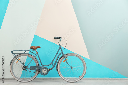 Retro bicycle near color wall photo