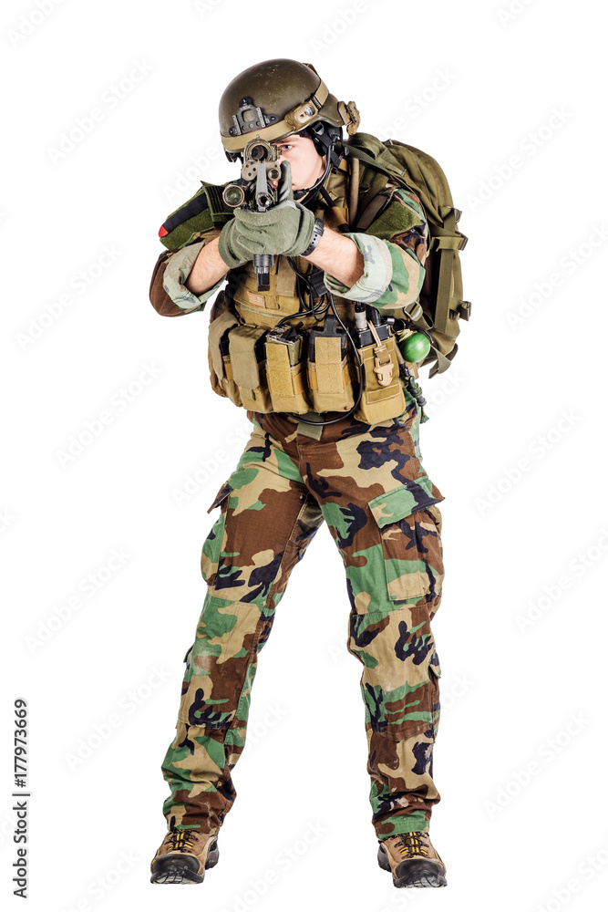 Portrait soldier or private military contractor holding sniper rifle. Portrait soldier or private military contractor holding sniper rifle.