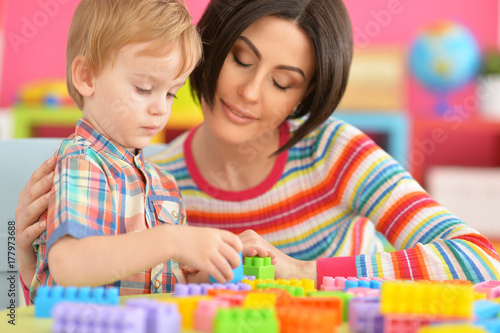 Young mother playing with son