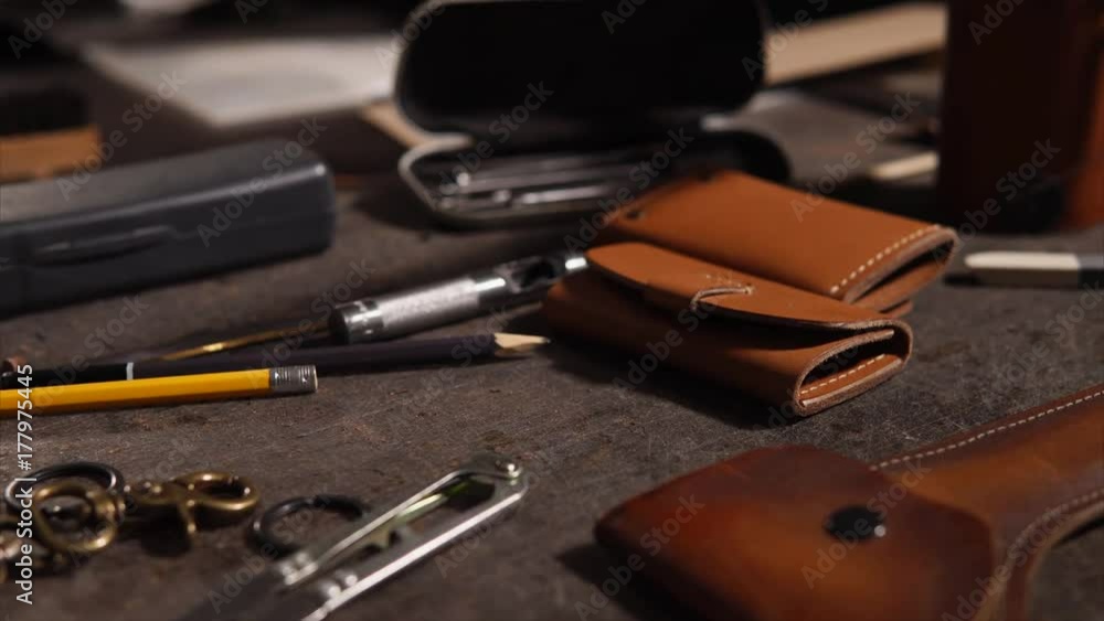 Tools on the table at the workshop of leather craftsman Tools on the table at the workshop of leather craftsman