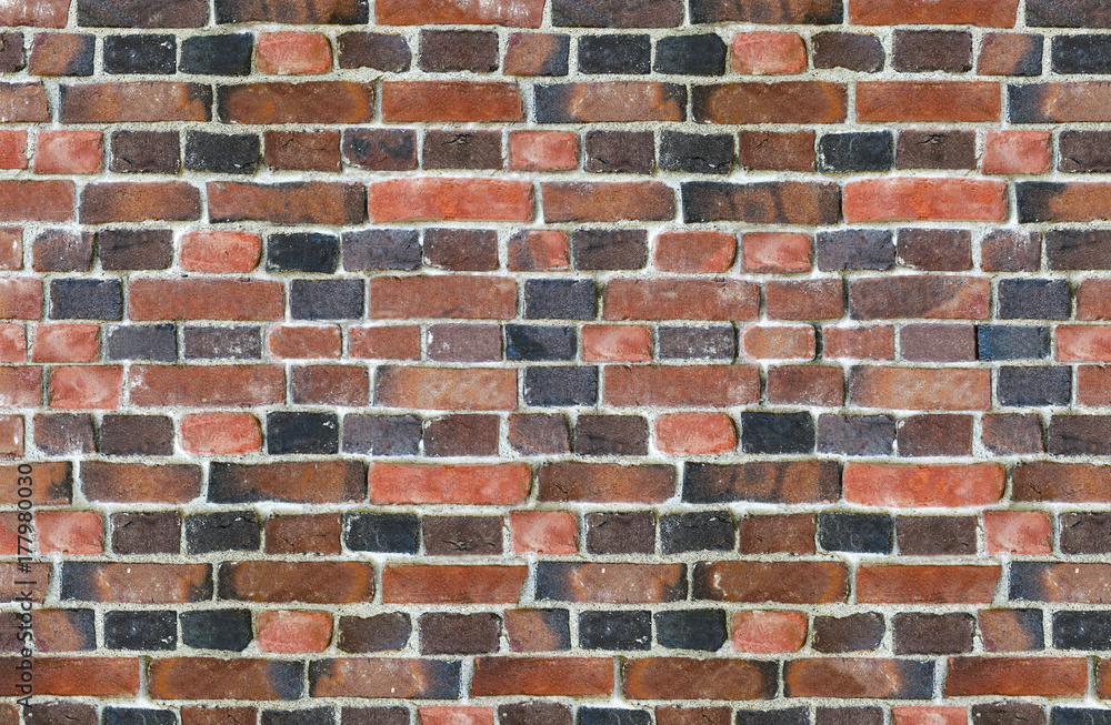 part of old brick wall consisting of bricks of different shades part of old brick wall consisting of bricks of different shades