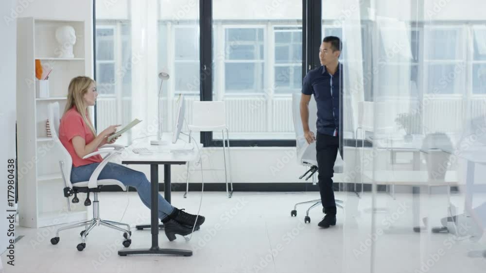 Young business team brainstorming for ideas in office meeting. Shot on RED Epic. Young business team brainstorming for ideas in office meeting. Shot on RED Epic.