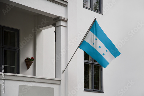 Cuadro en lienzo Honduras flag displaying on a pole in front of the house